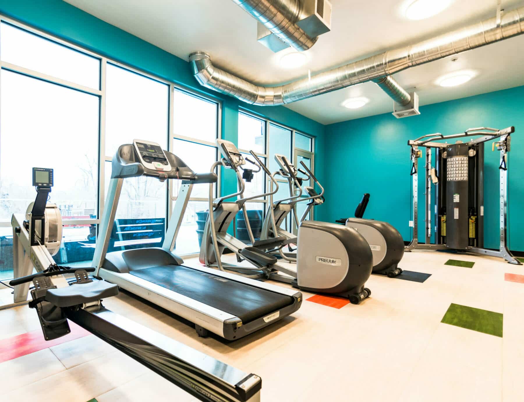 treadmills in gym - interior designs by Think Architecture