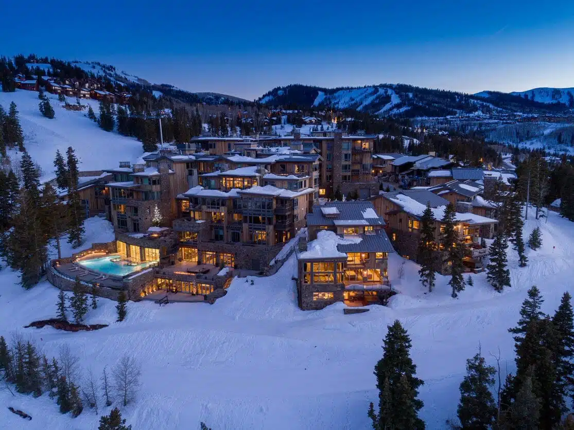 Park City resort at night in winter with lights inside - Think Architecture