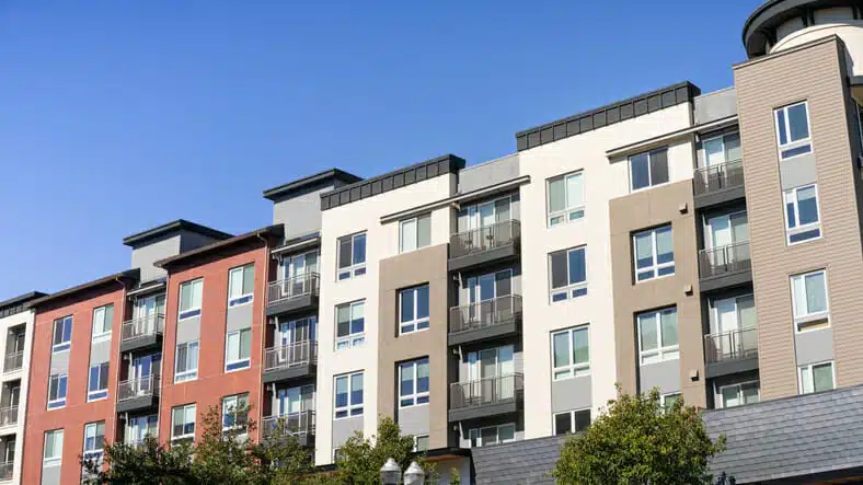 Exterior view of modern mixed use real estate development apartment building