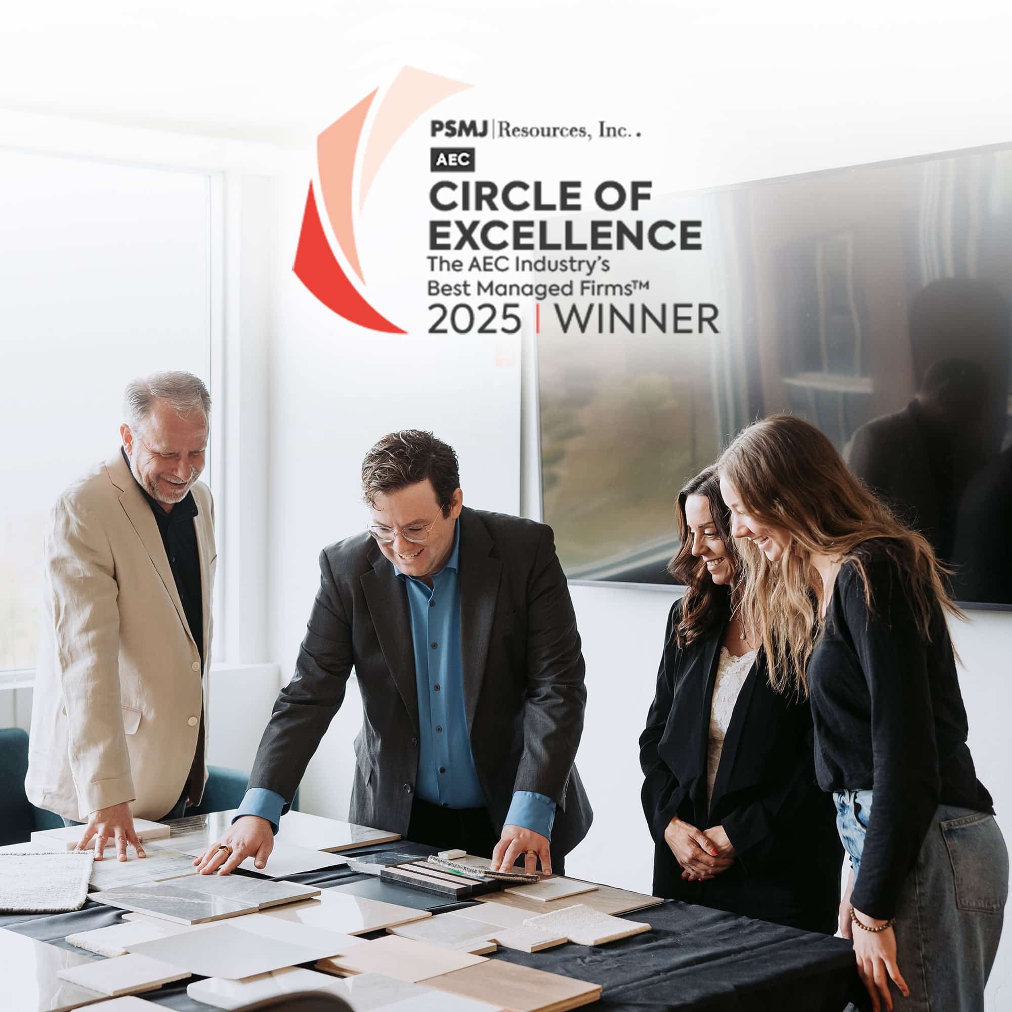 Think Architecture team reviews material samples in the studio, with the PSMJ Circle of Excellence 2025 Winner logo visible, highlighting the firm’s recognition among top AEC firms in the United States.
